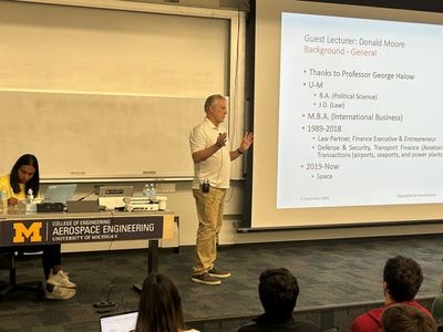 Donald Pierce Moore presenting at an academic lecture